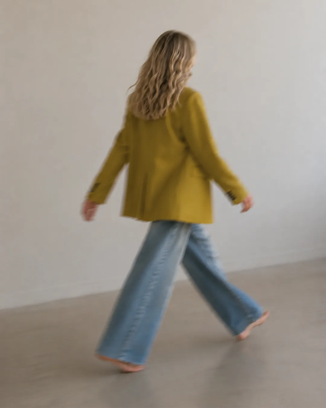 Haley Staverosky walking through a studio space